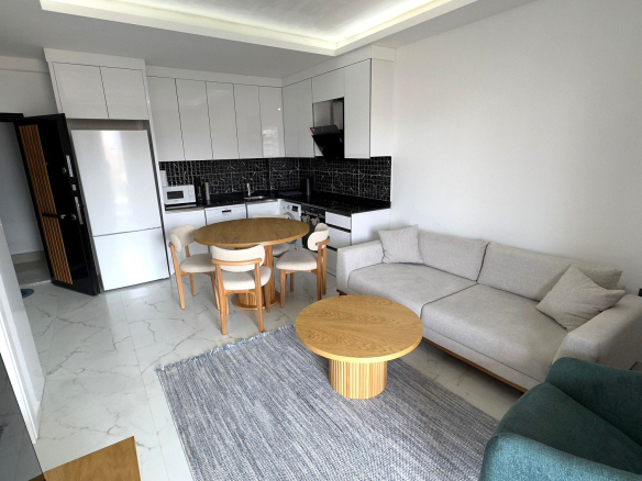 ID1308A 3+1 furnished penthouse with mountain views in a new complex in the center of Mahmutlar