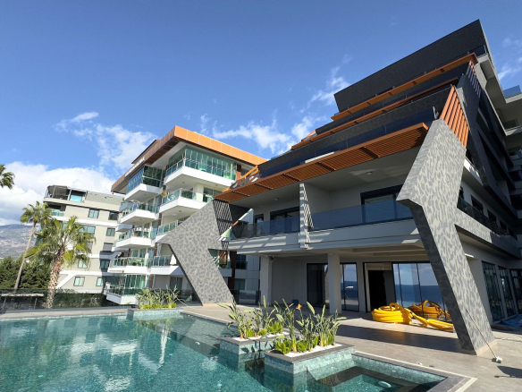 ID1352A 2+1 apartment with a view of the fortress and sea in a premium complex on the 1st line in Kargicak
