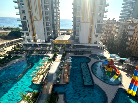 ID1401a Furnished 1+1 apartment with sea and pool view in Mahmutlar